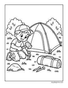 A boy in a cap kneeling and hammering a tent peg with a mallet beside a dome tent, with a rolled tent bag, two pegs and bushes