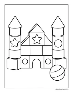 A castle built from toy blocks with stars and circles and two cone-topped towers, with a ball