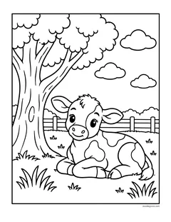 A spotted calf lying in the grass under a big tree