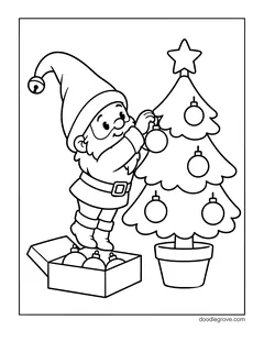 A gnome standing on a box of ornaments and hanging baubles on a small potted Christmas tree with a star on top