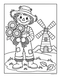 A scarecrow holding a big bunch of sunflowers next to a windmill