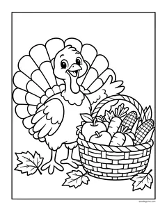 A turkey next to a woven basket full of apples, carrots and corn, with fall leaves